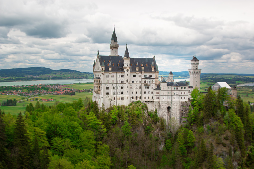 Neuschwanstein Castle (German: Schloss Neuschwanstein) is a 19th-century Romanesque Revival palace on a hill near Fussen and Schwangau in southwest Bavaria, Germany. The palace was commissioned by Ludwig II of Bavaria as a retreat and as a homage to Richard Wagner. More than 1.3 million people visit this castle every year, making it one of the most popular and famous in the world.