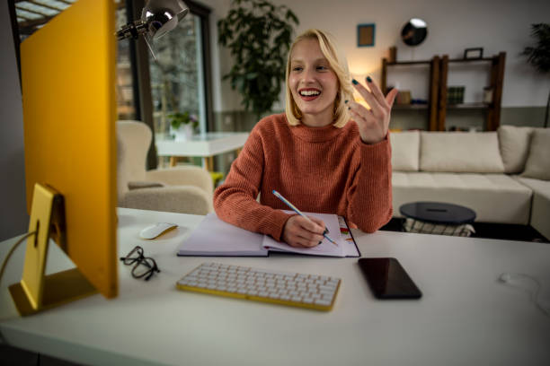 istock Young woman working on computer at home 1399073892
