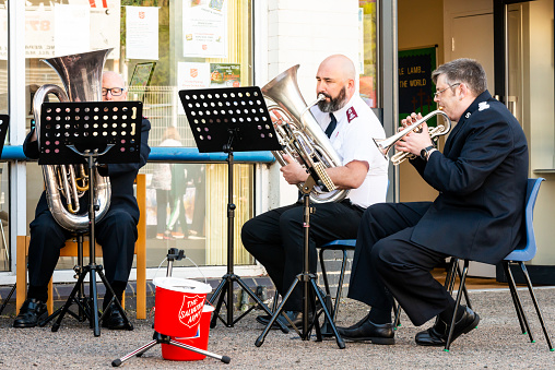 London, Penge, United Kingdom - April 30, 2022: Maple Road Market (a revival of a historical street market in Penge, now a celebration of local small businesses, art and culture). Salvation Army brass band playing