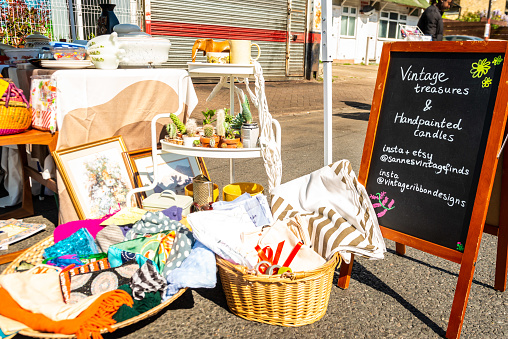 London, Penge, United Kingdom - April 30, 2022: Maple Road Market (a revival of a historical street market in Penge, now a celebration of local small businesses, art and culture). Vintage stall with goods displyed for sale