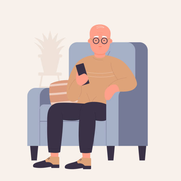 Senior man in comfortable armchair watching tv Senior man in comfortable armchair watching tv. Old male holding remote control device cartoon vector illustration old remote control stock illustrations