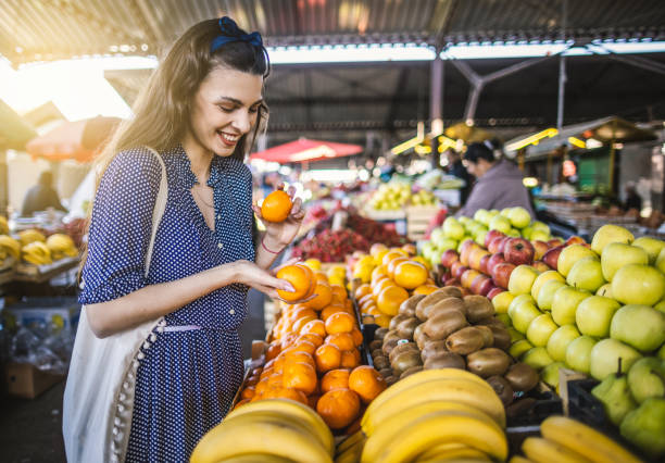 istock Young woman on the market 1399077610