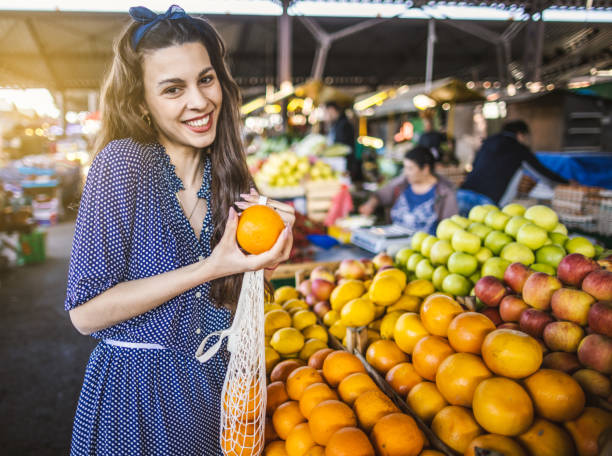 istock Young woman on the market 1399077827