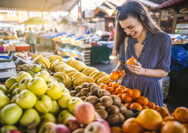 istock Young woman on the market 1399078384