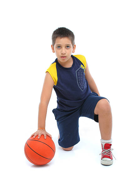 istock Boy playing basketball isolated 139908447