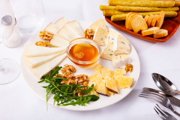 istock Different types of cheese sliced and served on plate 1399085158