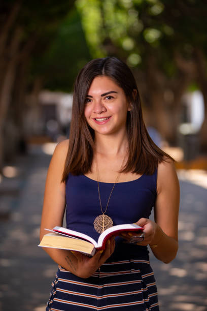 istock Student woman with her books on her hands. 1399085936