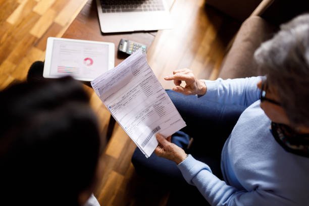 istock Women talking about bill payments at home 1399087171
