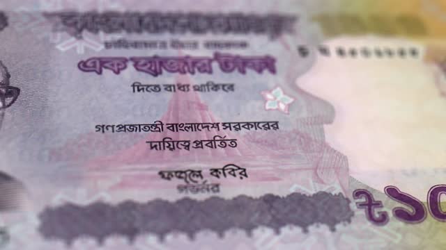 Banknotes of the Bangladesh 1000 Taka Observe and Reserve Side Close up of a Tracking Dolly Shot 1000 Bangladesh Notes Current 1000 Bangladesh Takas Banknotes 4k Resolution stock video - Bangladesh Money Currency Background Financial Inflation