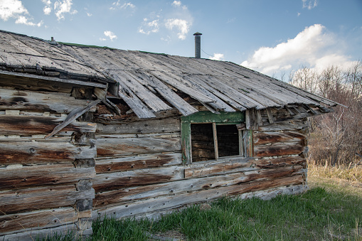 Homestead log house on ranch land in northern Montana in northwest USA.