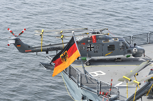 Tokyo, Japan - November 07, 2021:Naval Jack of German Navy and Westland Sea Lynx Mk.88A anti-submarine helicopter.