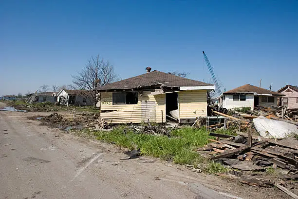 Heavily damaged homes in the Ninth Ward of New Orleans. One block behind these homes is the industrial canal that collapsed during the storm surge of hurricane Katrina.