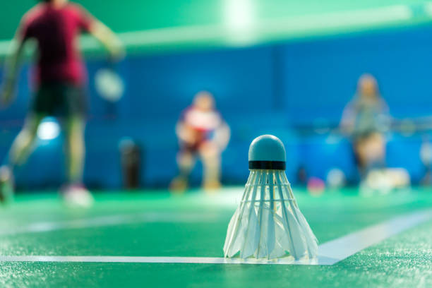 istock Badminton courts with players competing 1399094308