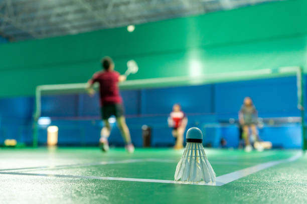 istock Badminton courts with players competing 1399094310