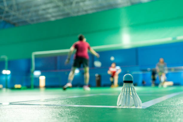 istock Badminton courts with players competing 1399094336
