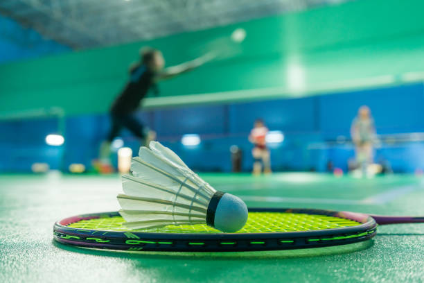 istock Badminton courts with players competing 1399094360