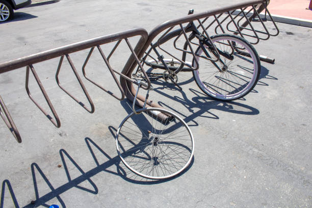 A view of several bike parts left behind on a bicycle rack.