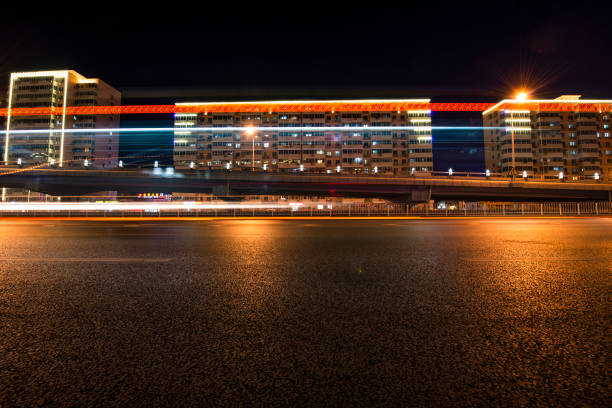 Long exposure of traffic in curve with red and white trails of light