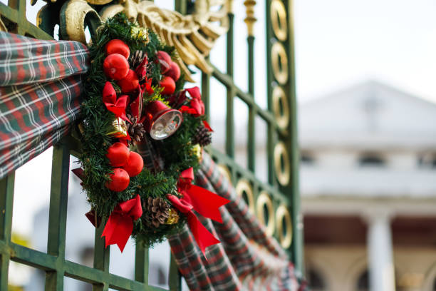 The Christmas Wreath hanging on iron gate. stock photo
