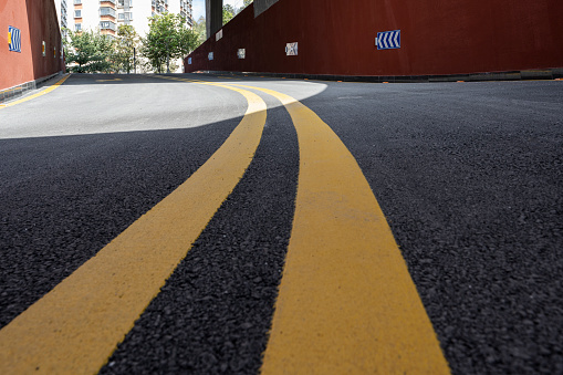New asphalt road background and new yellow line, top view