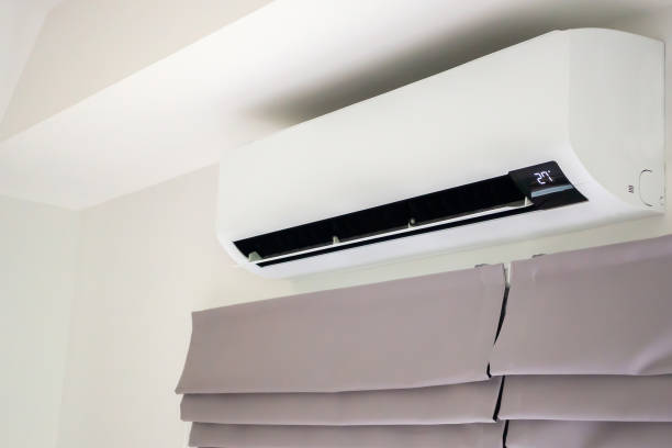 istock Air conditioner on white wall room interior background 1399097410
