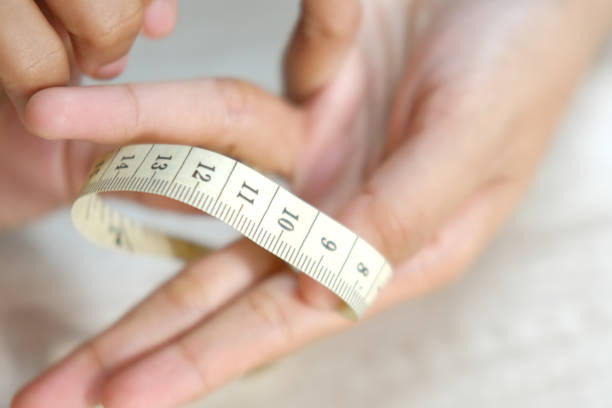 istock Female hand measuring finger 1399100391