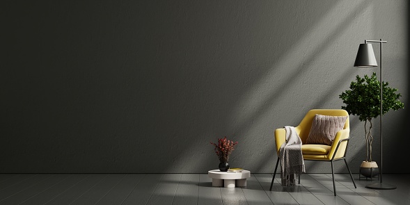 Wall mock up in dark tones with yellow armchair on black wall background.3d rendering