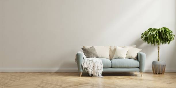 istock Living room interior wall mock up with sofa and plant on white wall background. 1399101073