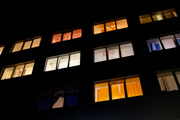 istock glowing windows in a residential multi-storey building at night 1399101238