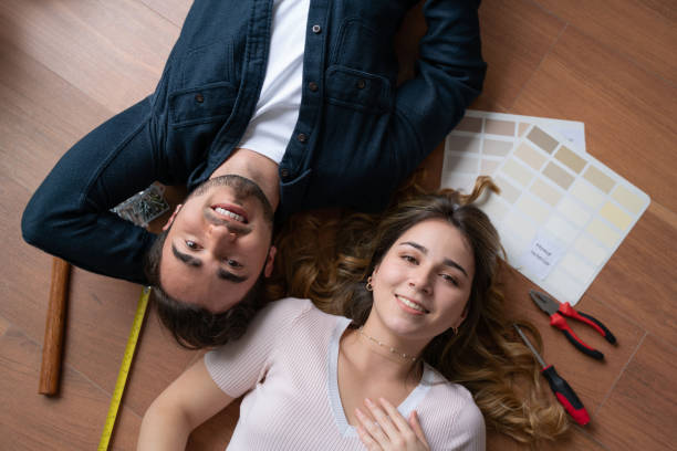istock Young millennial couple remodeling their house 1399103307