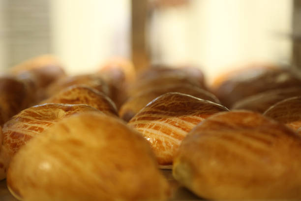 Puff pastries Puff pastries (Turkish: Pogaca) in the bakery shop. sesame bagel stock pictures, royalty-free photos & images