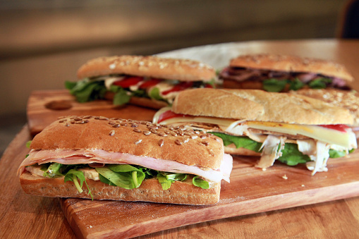 Delicious vegetarian  sandwich on wooden restaurant table