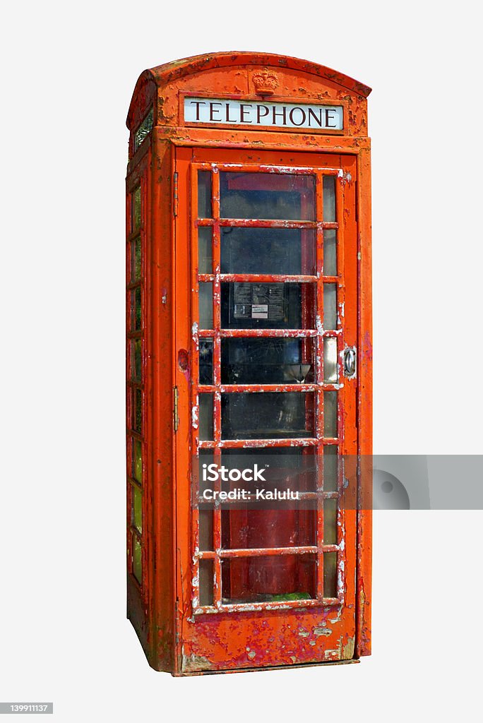 Grungy telephone box (Clipping path included) A grungy British telephone box, isolated on a white background. (Clipping path included) British Culture Stock Photo