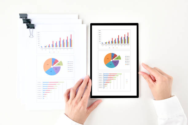 istock Business paper document and business man's hands using tablet device 1399118221