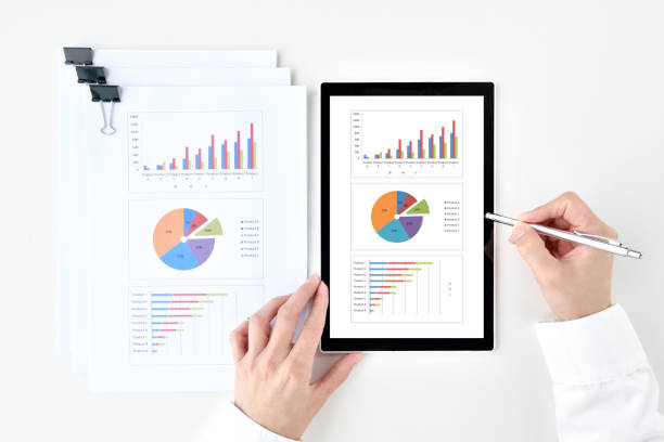 istock Business paper document and business man's hands using tablet device 1399118231