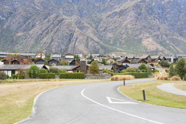 Stret leading and curving towards New Residential district in alpine locality