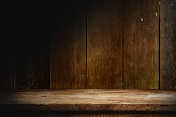 istock Wooden table in dark room background. 1399126430