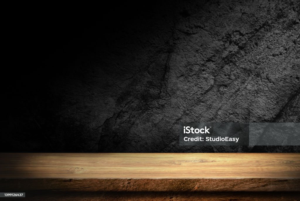 Table in dark room background . Wooden table in dark room background concept for advertising. Darkroom Stock Photo