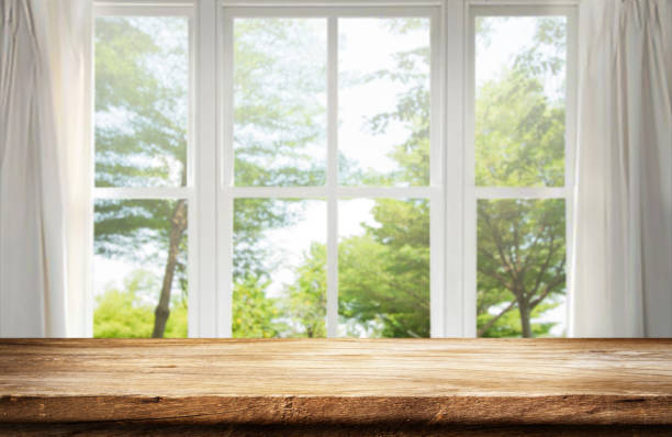 istock table wooden behind is a window background. 1399126480