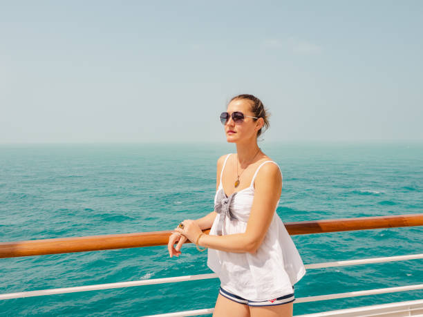 istock Beautiful woman standing on the empty deck 1399128299
