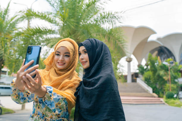 istock Two Arab female taking a selfie in front of a mosque. 1399135204