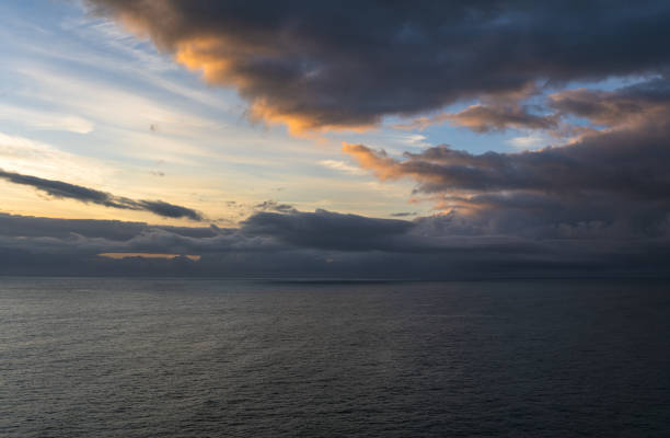 istock Dramatic sky over the sea at sunrise 1399135431