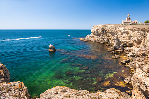 Beautiful sea coast with turquoise water and rocks. Tarhankut Cape on the western coast of Crimea peninsula. Summer seascape, famous travel destination
