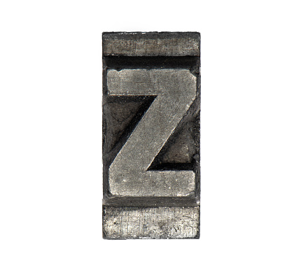 close up macro metal lead letter on white background showing capitol Z for text setting at printing house
