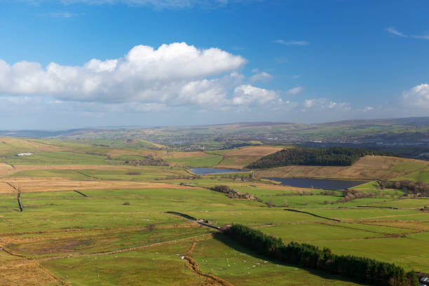 view of reservoirs beneath pendle hill near clitheroe in lancashire, england. - pendle imagens e fotografias de stock