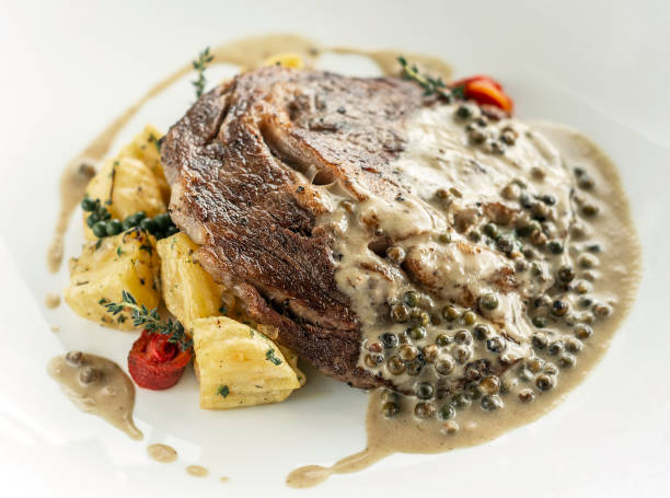 rib eye steak with creamy peppercorn sauce