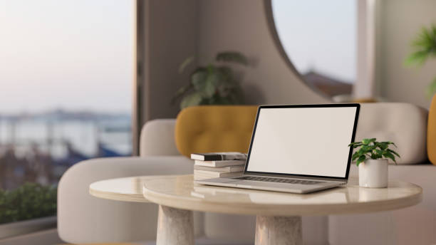 istock Notebook laptop mockup and decor on modern marble white coffee table 1399137617