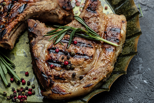 pork chop serve with rosemary. Food recipe background. Close up.