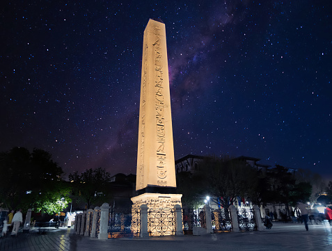 The symbolic ancient sultanahmet column at night time with hieroglyphics