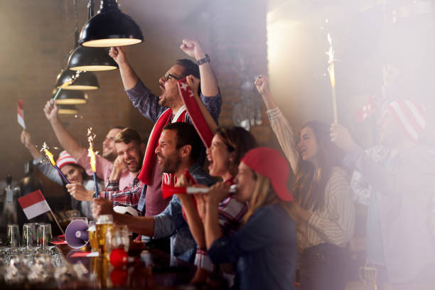 istock Cheering for sports team in a pub! 1399140561